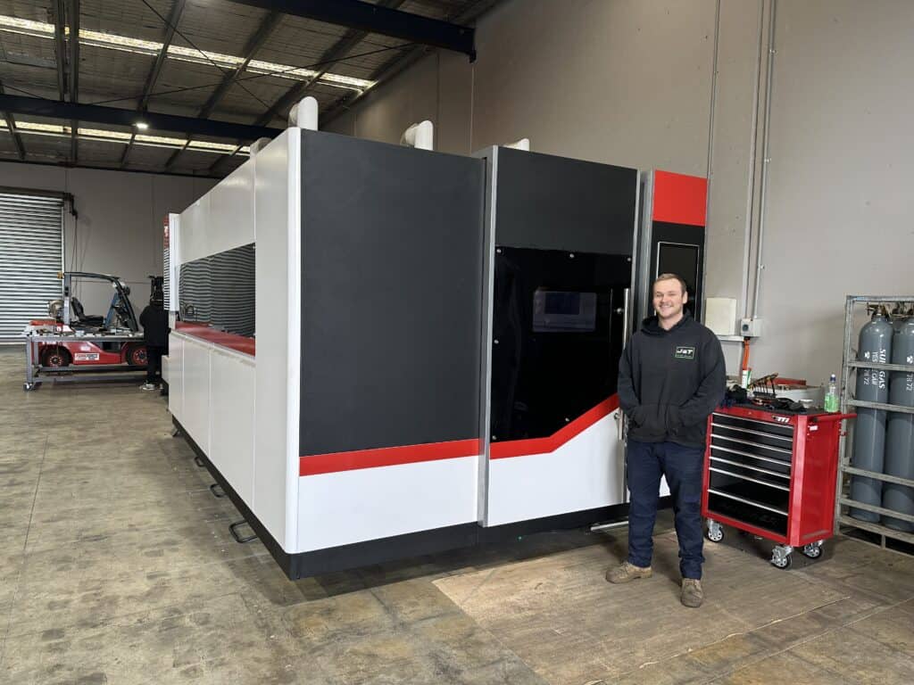 J&T Steel Sales Operations Manager, Luke Patterson, with the company’s laser cutting machine
